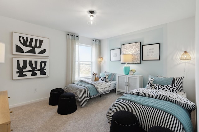 carpeted bedroom with baseboards