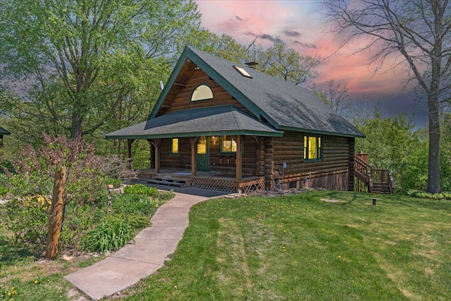 1100 155th St, Garfield Twp, WI 54001 - log home featuring log siding, a porch, a front yard, and stairway