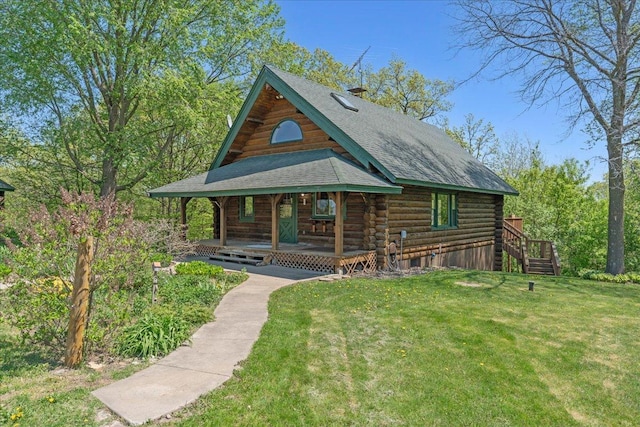 1100 155th St, Garfield Twp, WI 54001 - view of front of house with log exterior, a porch, a front yard, roof with shingles, and stairs