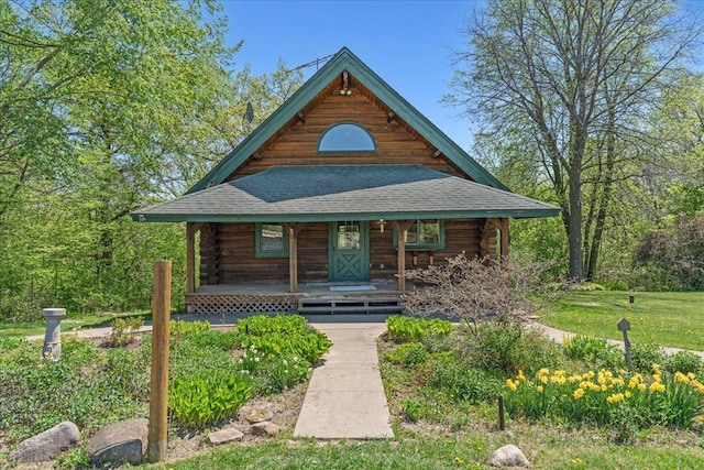 1100 155th St, Garfield Twp, WI 54001 - log-style house with log exterior, covered porch, and a shingled roof