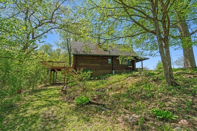 1100 155th St, Garfield Twp, WI 54001 - view of side of property featuring log siding and a deck