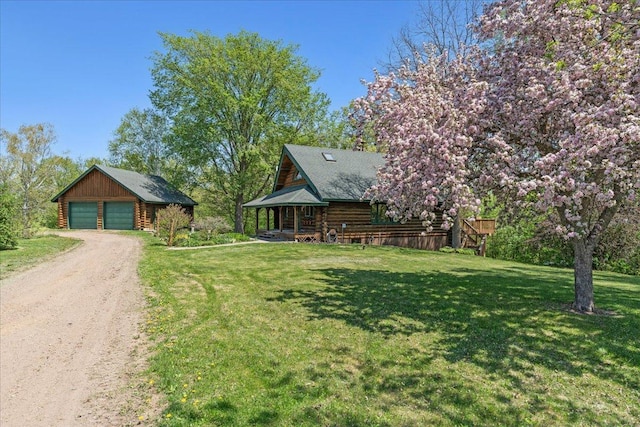 1100 155th St, Garfield Twp, WI 54001 - view of front of property with a detached garage, an outbuilding, a front yard, and log exterior