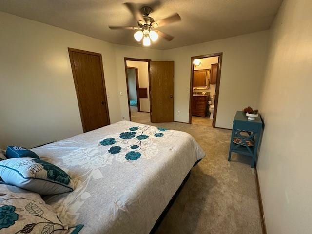 11620 Oregon Ave N, Champlin, MN 55316 - bedroom with light colored carpet, a ceiling fan, and ensuite bath