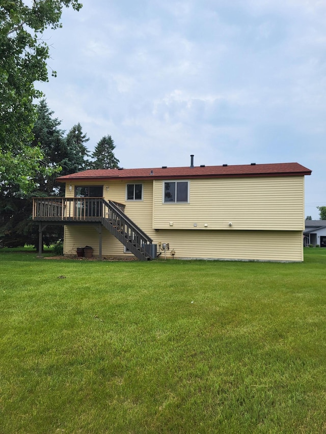 11620 Oregon Ave N, Champlin, MN 55316 - rear view of house with stairway, a wooden deck, and a yard