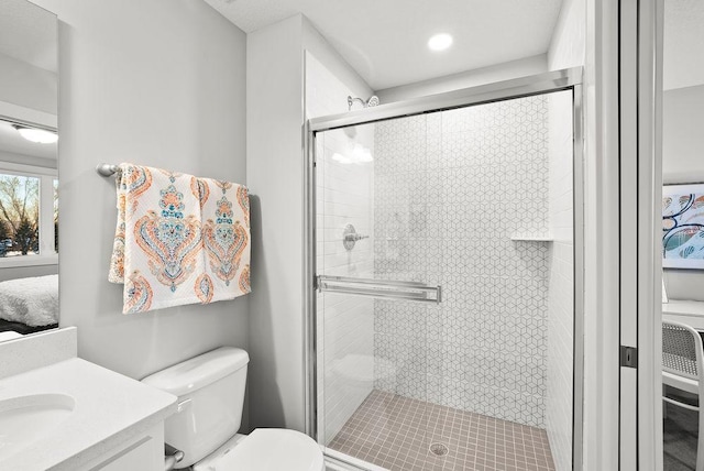 bathroom featuring toilet, vanity, ensuite bath, and a shower stall