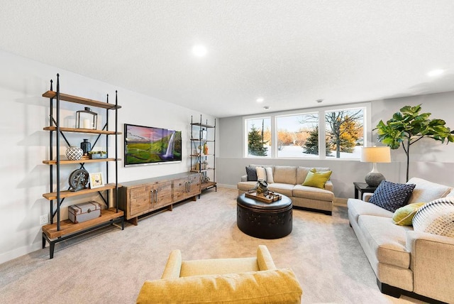 living room with baseboards, carpet flooring, a textured ceiling, and recessed lighting