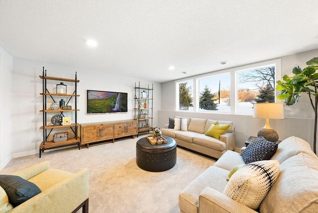 carpeted living room featuring baseboards, recessed lighting, and a textured ceiling