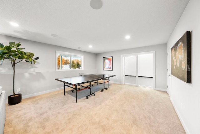 rec room with baseboards, recessed lighting, carpet flooring, and a textured ceiling