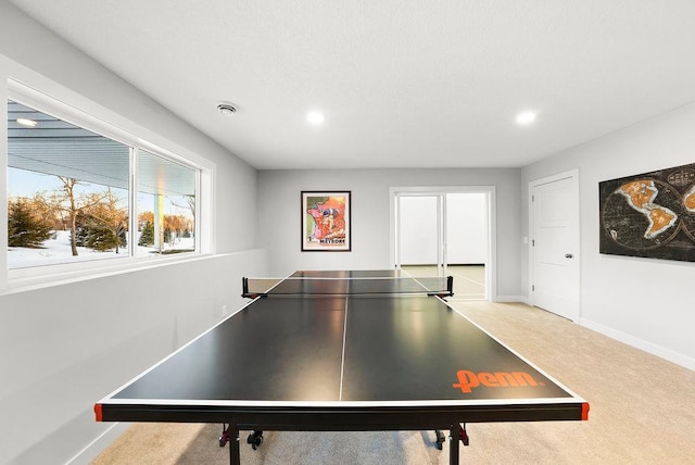 recreation room featuring baseboards, carpet floors, visible vents, and recessed lighting