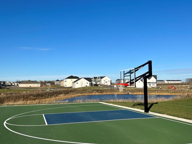 view of sport court featuring community basketball court and a residential view