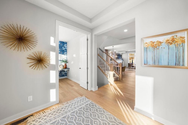 2712 Kensington Ave NE, Saint Michael, MN 55376 - foyer entrance with stairs, wood finished floors, a chandelier, and baseboards