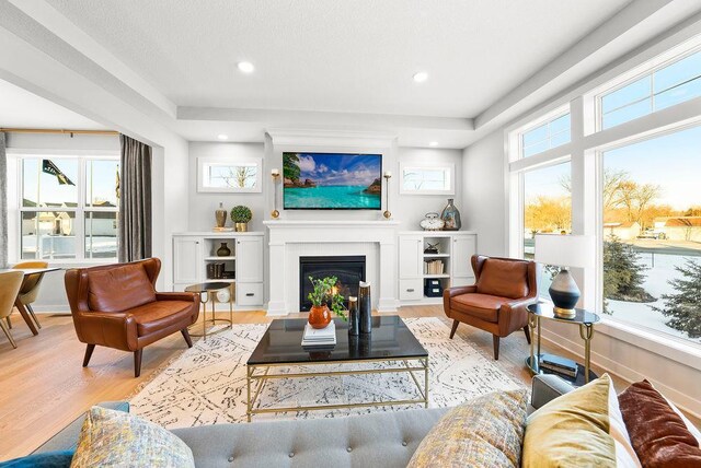 2712 Kensington Ave NE, Saint Michael, MN 55376 - living area with light wood-style flooring, a fireplace, and recessed lighting