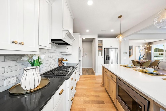 2712 Kensington Ave NE, Saint Michael, MN 55376 - kitchen with appliances with stainless steel finishes, custom exhaust hood, light wood-style flooring, white cabinetry, and recessed lighting