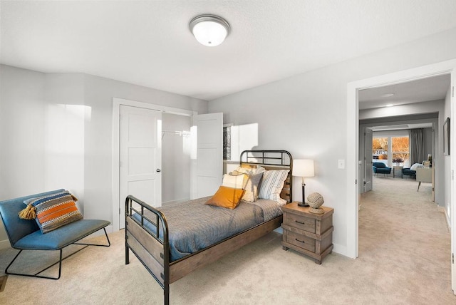 2712 Kensington Ave NE, Saint Michael, MN 55376 - bedroom featuring light colored carpet, baseboards, and a closet