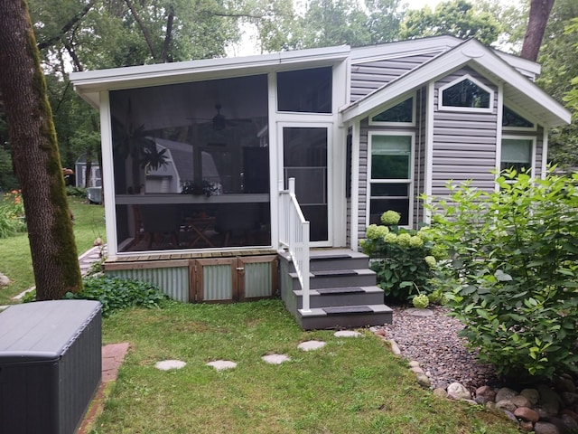 2945 County Road 4 SW Unit 69, Cokato, MN 55321 - view of front facade featuring a sunroom and a front lawn