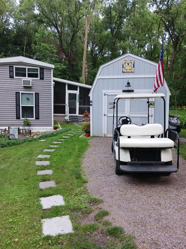 2945 County Road 4 SW Unit 69, Cokato, MN 55321 - view of grassy yard with a sunroom and view of scattered trees