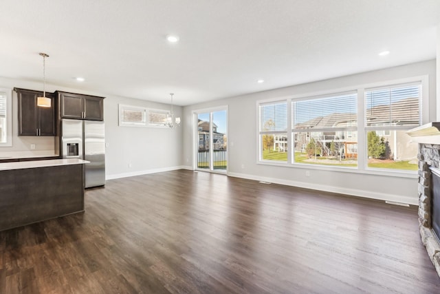 living room with baseboards, a fireplace, recessed lighting, and dark wood finished floors