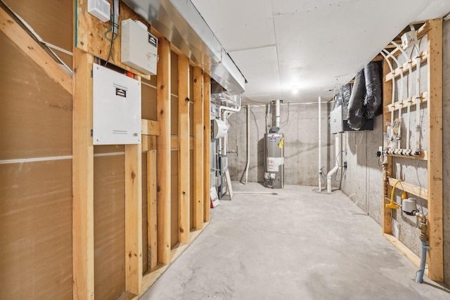 unfinished basement featuring water heater