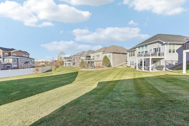 view of yard featuring a residential view and fence