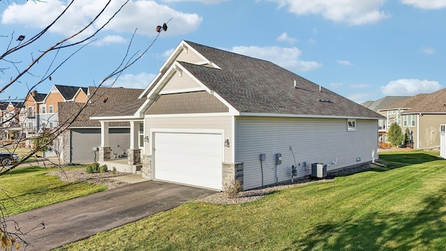 view of home's exterior with central air condition unit, an attached garage, a residential view, driveway, and a lawn