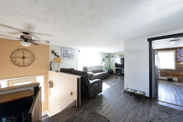 318 Morrison St, West Fargo, ND 58078 - living room featuring dark wood-type flooring, a ceiling fan, and a textured ceiling