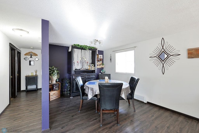 318 Morrison St, West Fargo, ND 58078 - dining area with dark wood-style floors, a textured ceiling, and baseboards