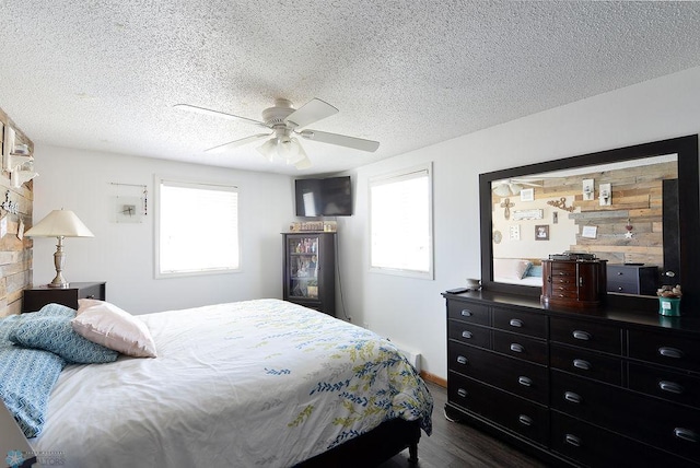 318 Morrison St, West Fargo, ND 58078 - bedroom featuring a textured ceiling, ceiling fan, and dark wood finished floors