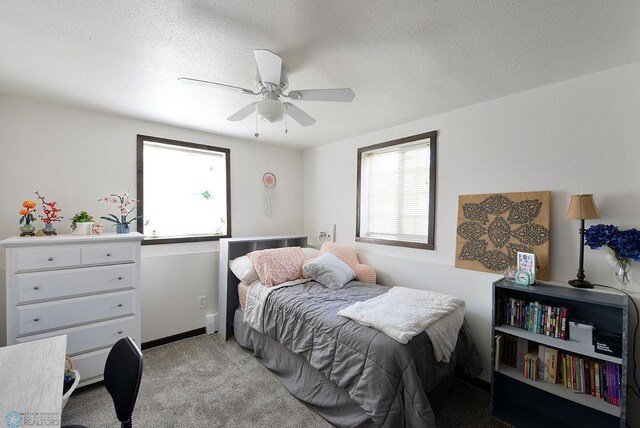 318 Morrison St, West Fargo, ND 58078 - bedroom with ceiling fan, light carpet, and a textured ceiling