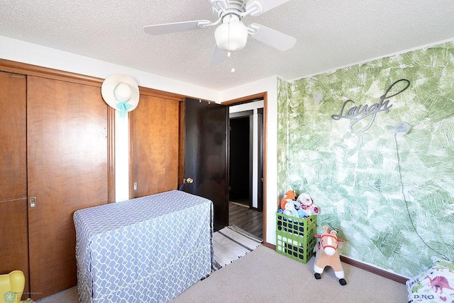 318 Morrison St, West Fargo, ND 58078 - bedroom with a textured ceiling, light colored carpet, a ceiling fan, and multiple closets