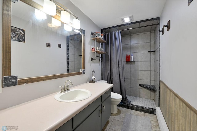 318 Morrison St, West Fargo, ND 58078 - full bathroom with vanity, tile patterned flooring, a wainscoted wall, toilet, and a stall shower