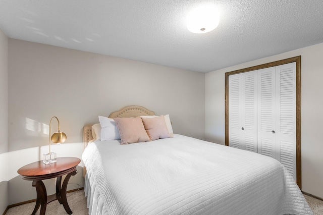 bedroom featuring carpet flooring, a closet, and baseboards