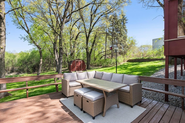 wooden terrace with a shed, a yard, an outbuilding, and an outdoor hangout area