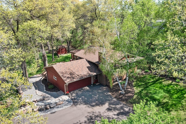 view of subject property with a heavily wooded area