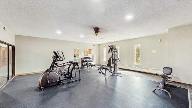 450 Ford Rd Unit 217, Saint Louis Park, MN 55426 - workout room featuring a textured ceiling, recessed lighting, and a baseboard radiator