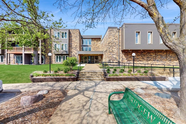 450 Ford Rd Unit 217, Saint Louis Park, MN 55426 - back of house featuring stone siding