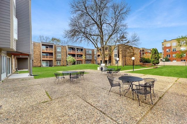 450 Ford Rd Unit 217, Saint Louis Park, MN 55426 - view of property's community featuring a yard, a patio area, a residential view, and outdoor dining area