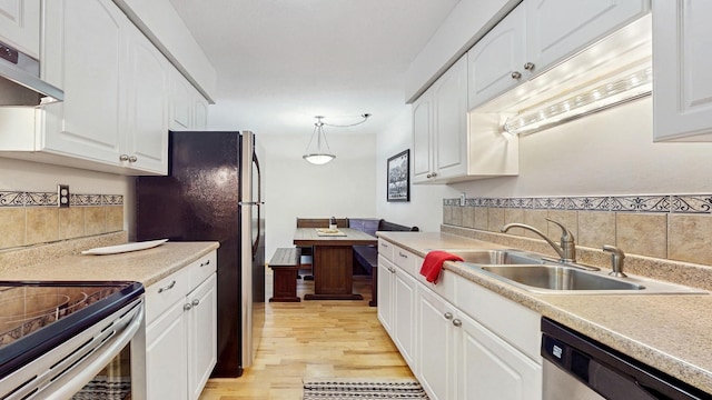 450 Ford Rd Unit 217, Saint Louis Park, MN 55426 - kitchen with dishwasher, tasteful backsplash, light wood-type flooring, and white cabinetry