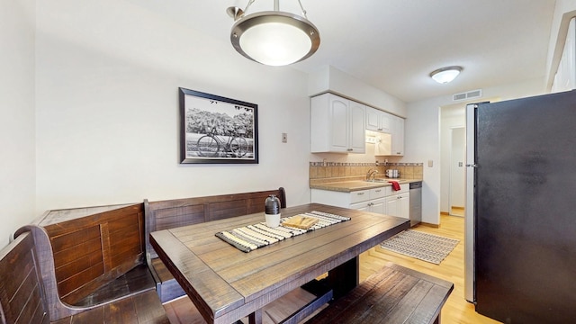 450 Ford Rd Unit 217, Saint Louis Park, MN 55426 - dining room featuring light wood-style flooring