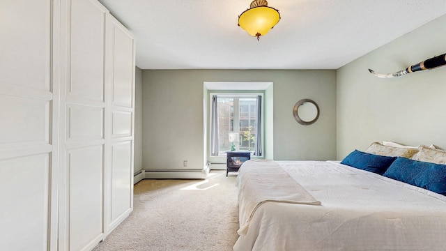 450 Ford Rd Unit 217, Saint Louis Park, MN 55426 - bedroom featuring baseboard heating, light colored carpet, and a wood stove
