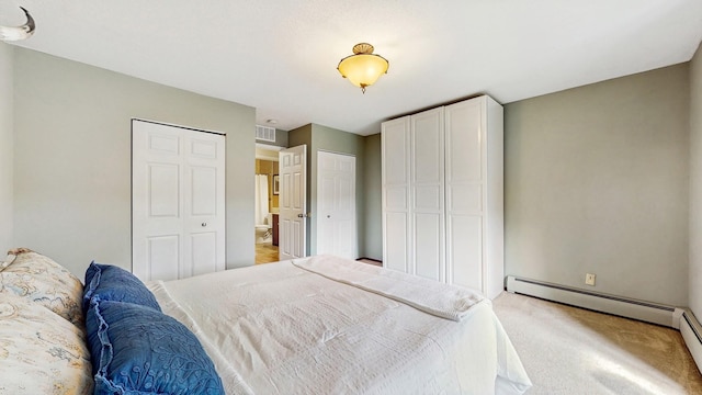 450 Ford Rd Unit 217, Saint Louis Park, MN 55426 - bedroom with light carpet and a baseboard heating unit