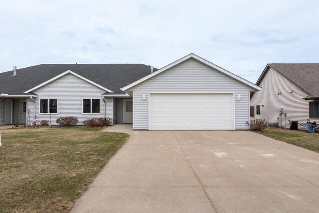 930 5th Ave, Goodhue, MN 55027 - single story home with a front yard, an attached garage, a shingled roof, and driveway