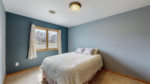 930 5th Ave, Goodhue, MN 55027 - bedroom with carpet flooring, visible vents, and baseboards