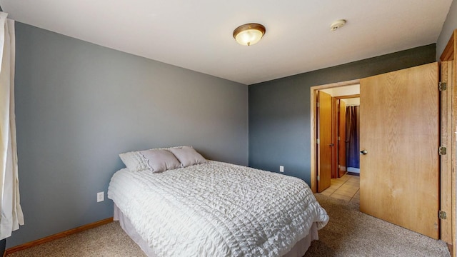 930 5th Ave, Goodhue, MN 55027 - bedroom with baseboards and light colored carpet