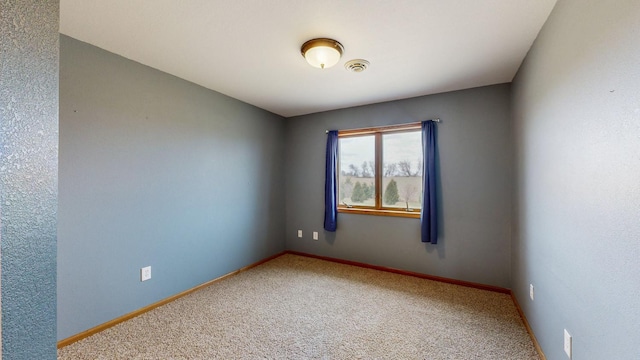930 5th Ave, Goodhue, MN 55027 - carpeted spare room featuring baseboards and visible vents