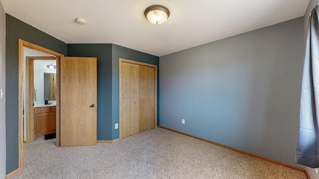 930 5th Ave, Goodhue, MN 55027 - unfurnished bedroom with a closet, baseboards, and carpet