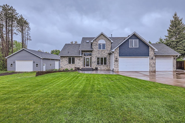 2833 162nd Ave NE, Ham Lake, MN 55304 - view of front of property with a front lawn, concrete driveway, roof with shingles, and a garage