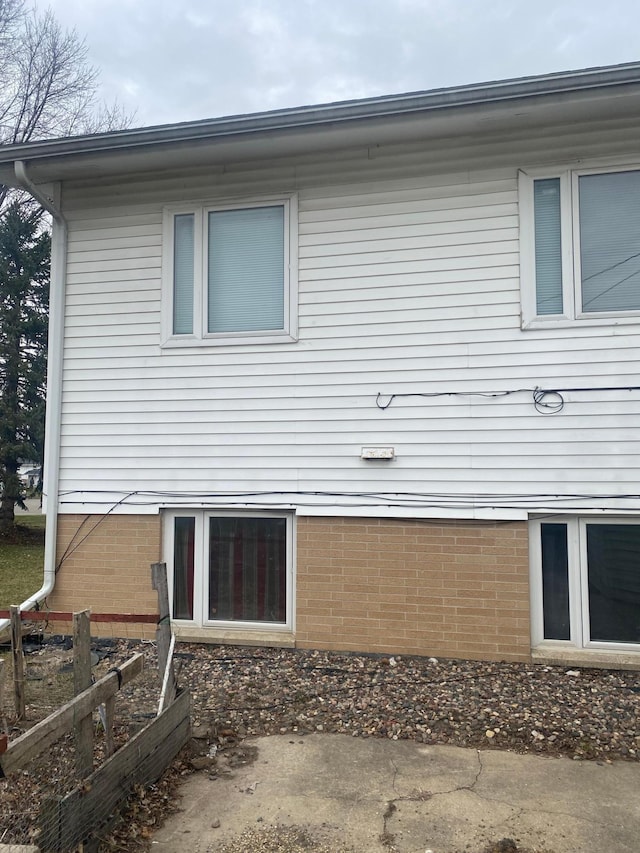 back of property with a vegetable garden