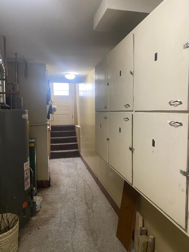 interior space featuring stairway and gas water heater