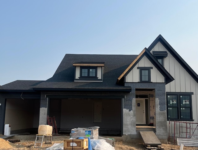 4036 Arbor Dr, Woodbury, MN 55129 - view of front of property with board and batten siding and roof with shingles
