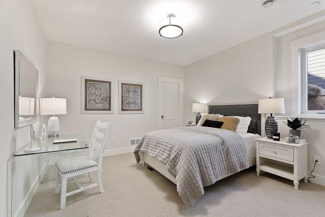 4036 Arbor Dr, Woodbury, MN 55129 - bedroom with carpet and baseboards